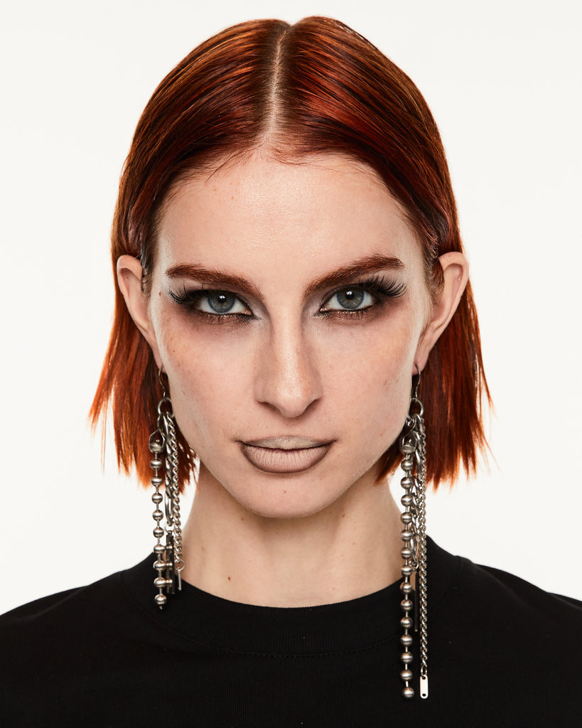 Silver ball chain dangle earrings on a white background